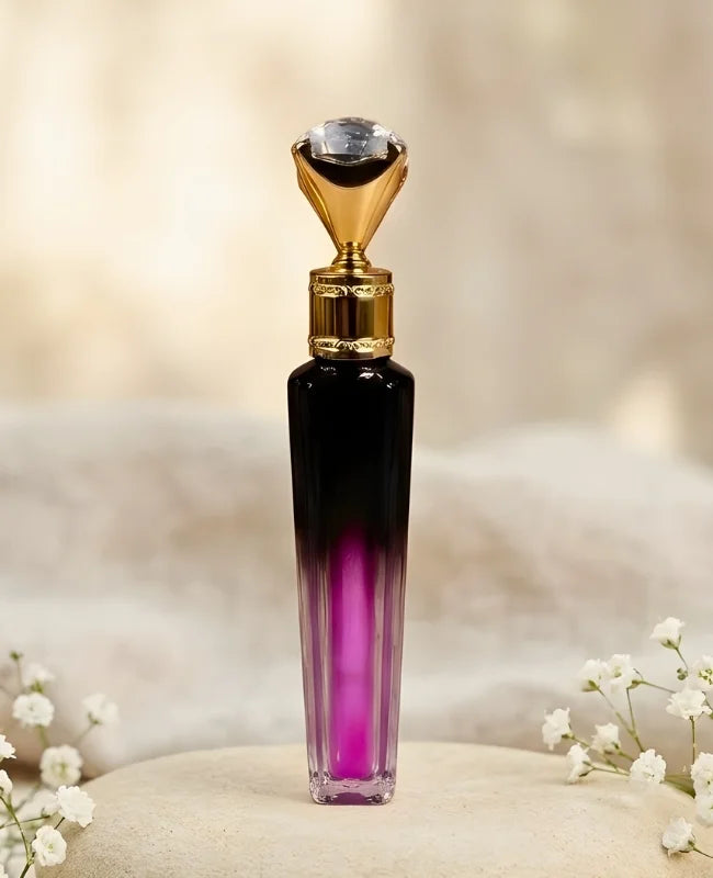 Perfume bottle with gold cap on a soft beige background