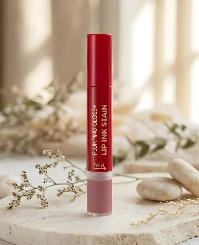 Lip gloss container with red and white design on a neutral background