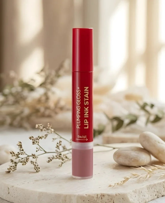 Lip gloss container with red and white design on a neutral background