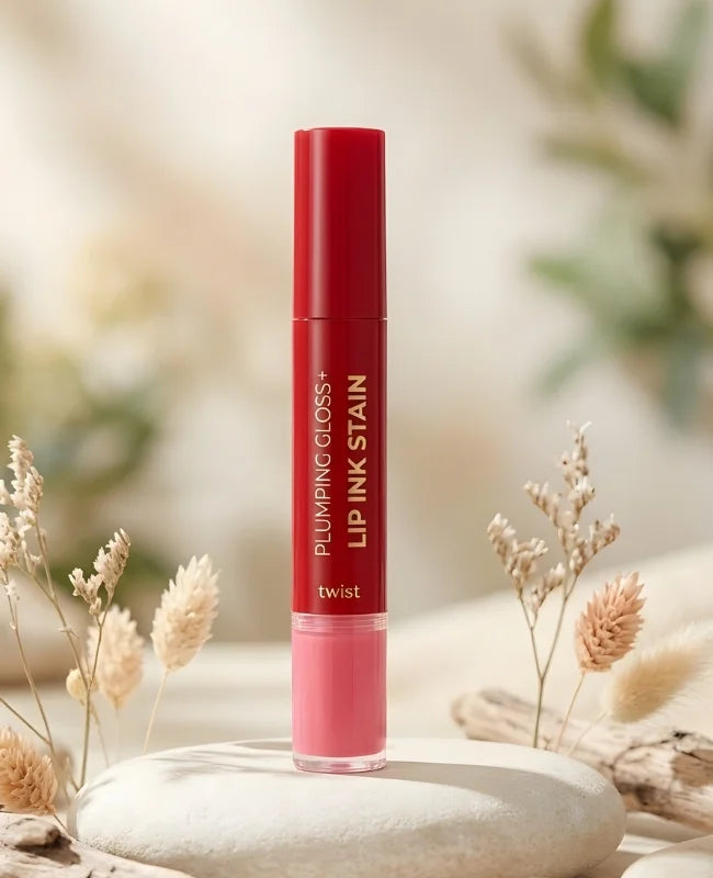 Lip ink stain with red cap and pink body on a blurred natural background